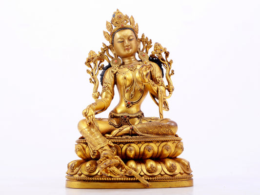 A majestic gilt bronze statue of green Tara