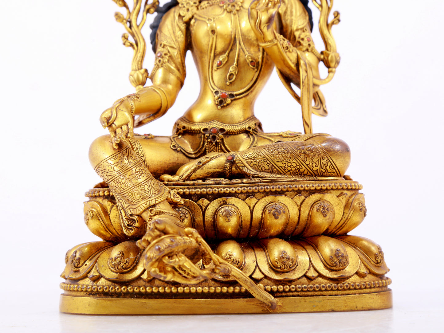 A majestic gilt bronze statue of green Tara