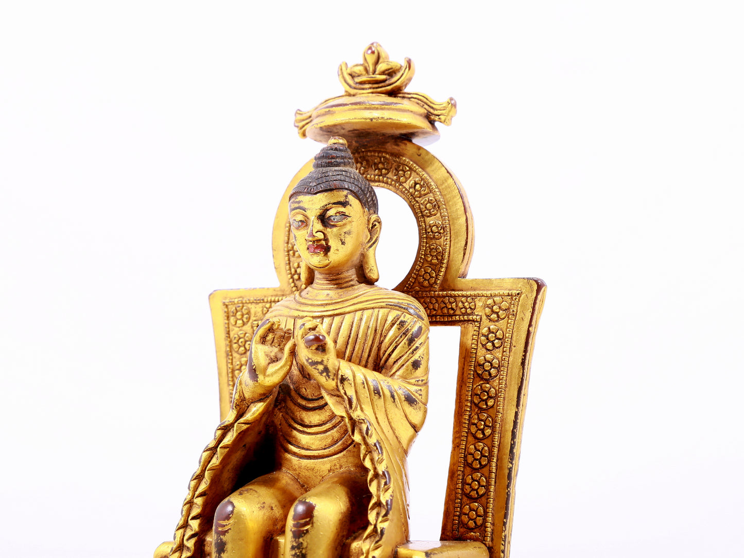 A majestic gilt bronze statue of Sakyamuni