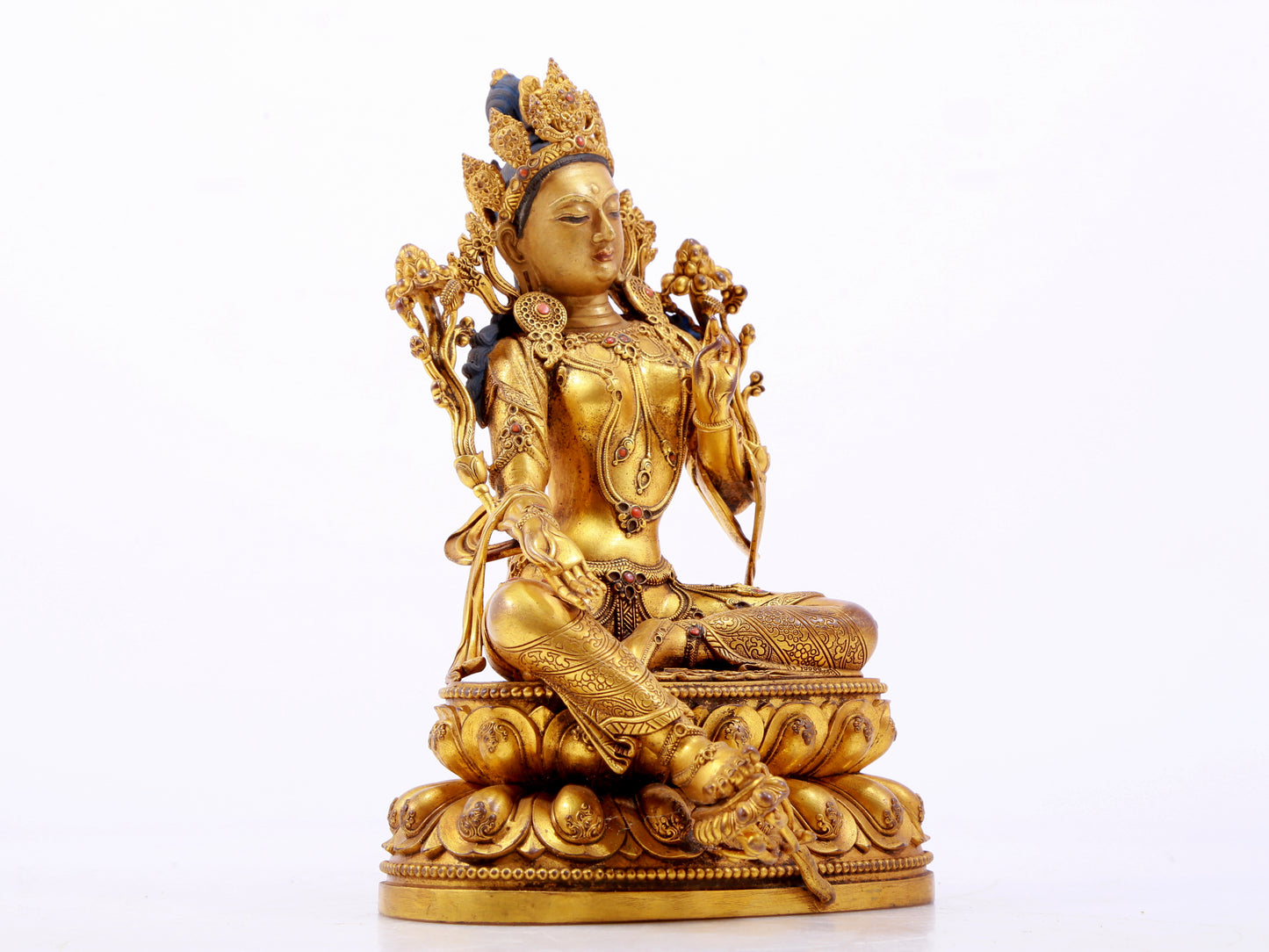 A majestic gilt bronze statue of green Tara