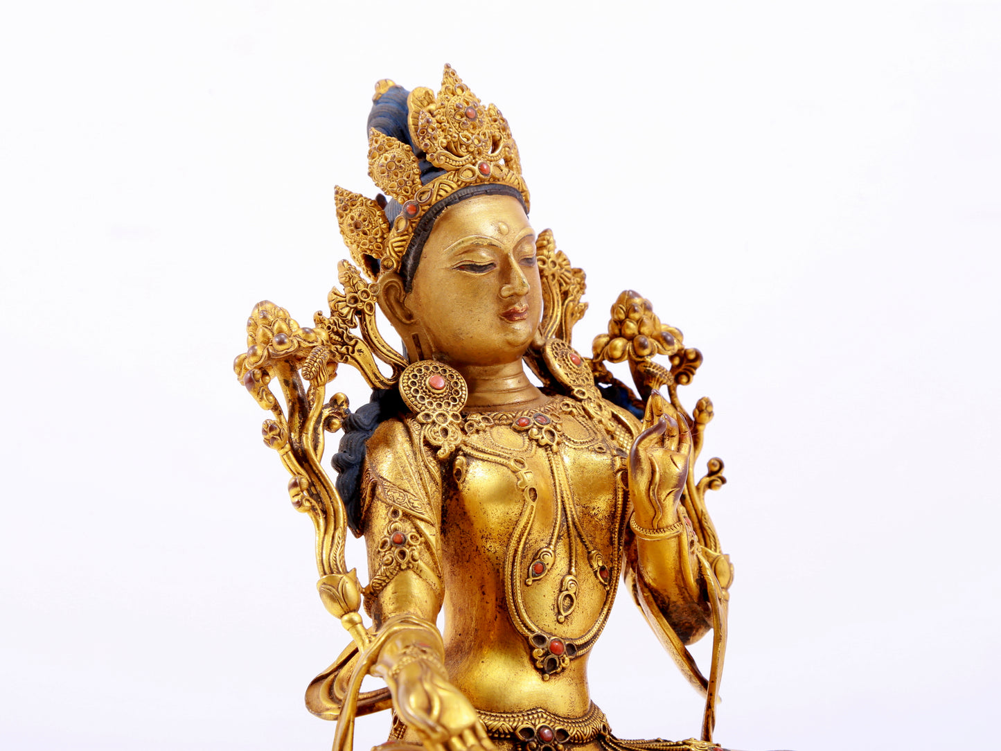 A majestic gilt bronze statue of green Tara