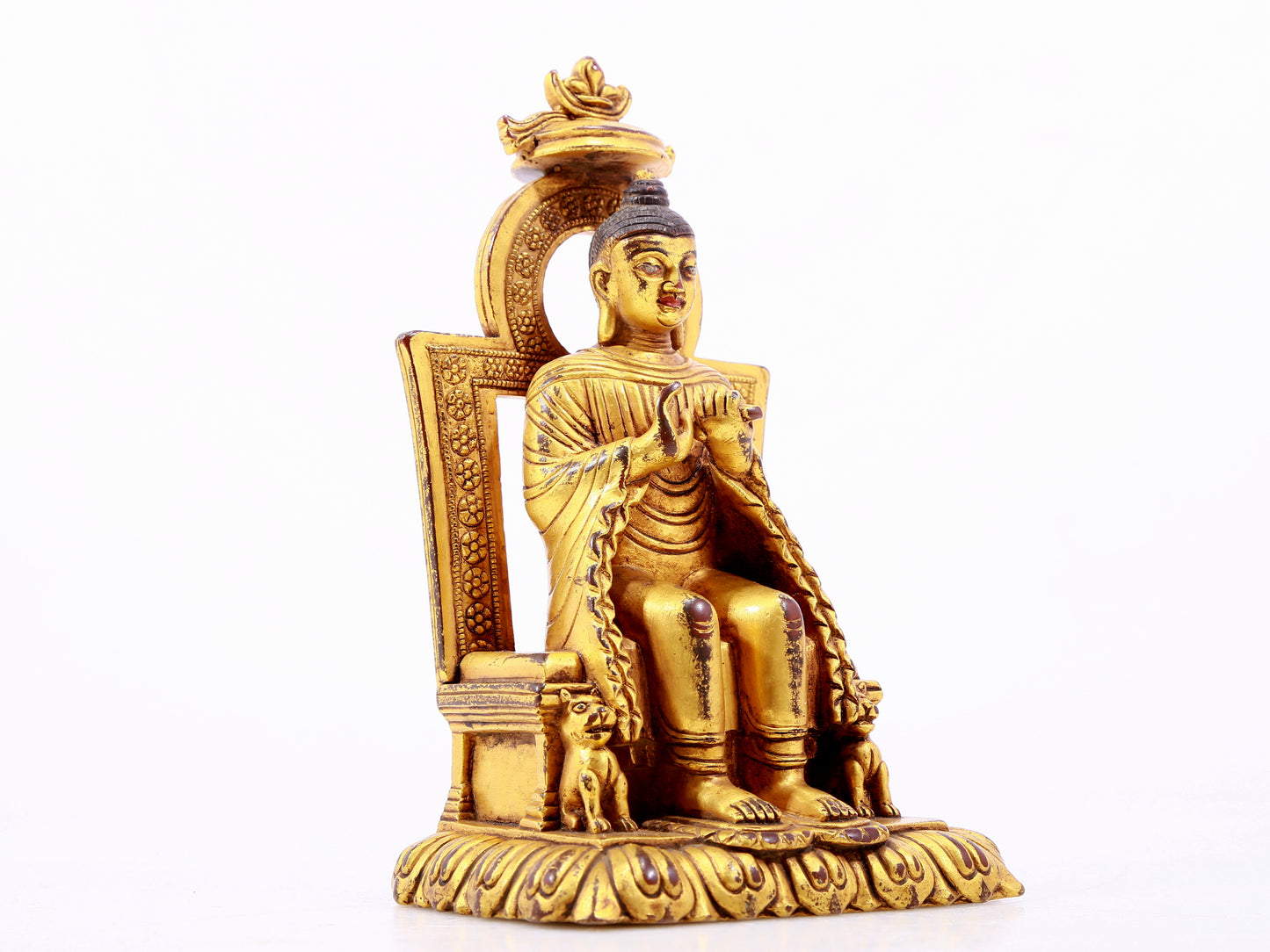 A majestic gilt bronze statue of Sakyamuni