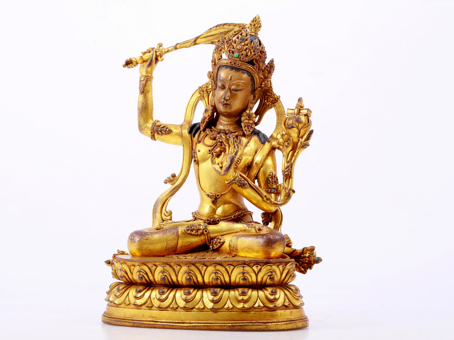 A solemn gilt bronze statue of Manjushri Bodhisattva inlaid with hundreds of treasures