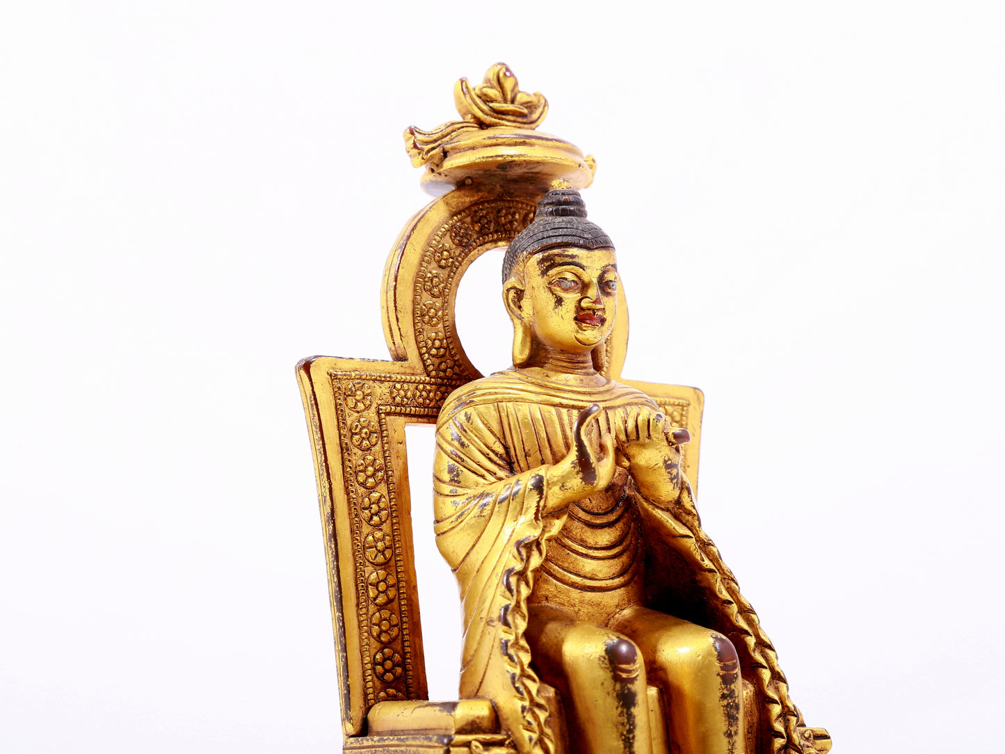 A majestic gilt bronze statue of Sakyamuni