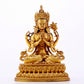 A majestic gilt bronze four-armed Guanyin statue