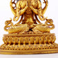 A majestic gilt bronze four-armed Guanyin statue