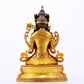 A majestic gilt bronze four-armed Guanyin statue