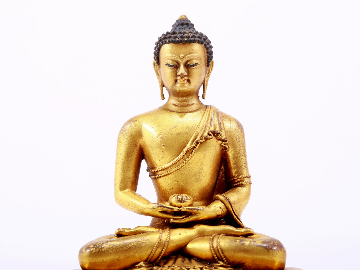 A majestic gilt bronze statue of Sakyamuni