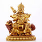 A majestic gilt bronze statue of the King of Treasures