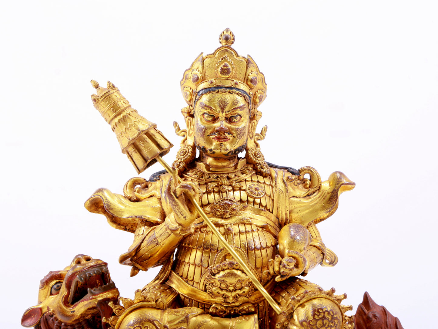 A majestic gilt bronze statue of the King of Treasures