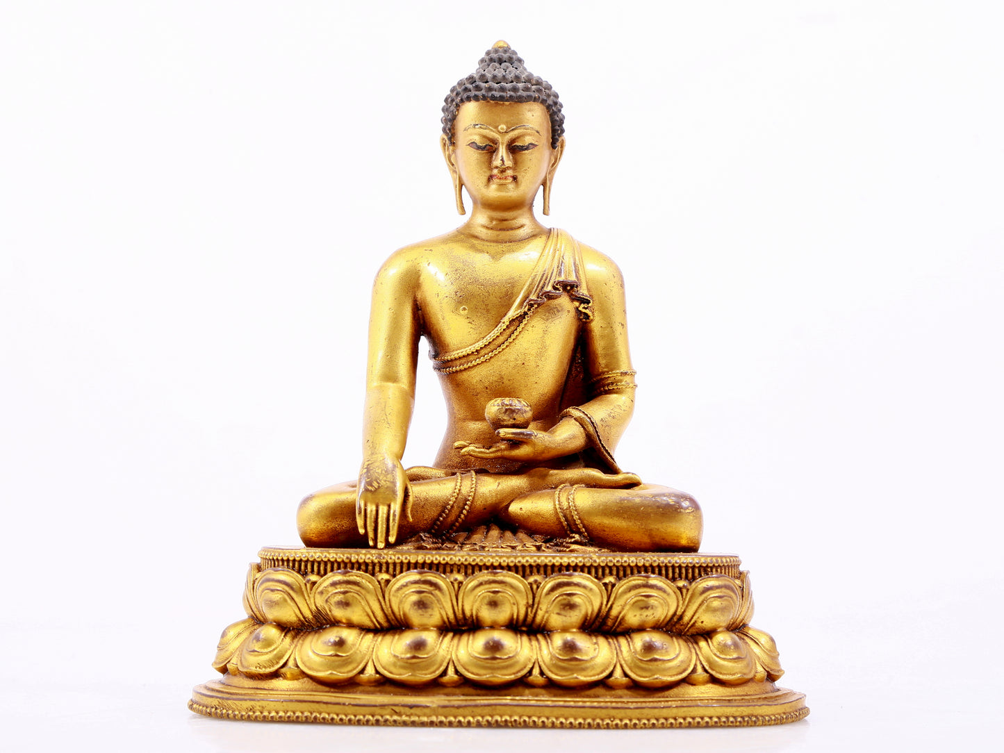 A majestic gilt bronze statue of Sakyamuni