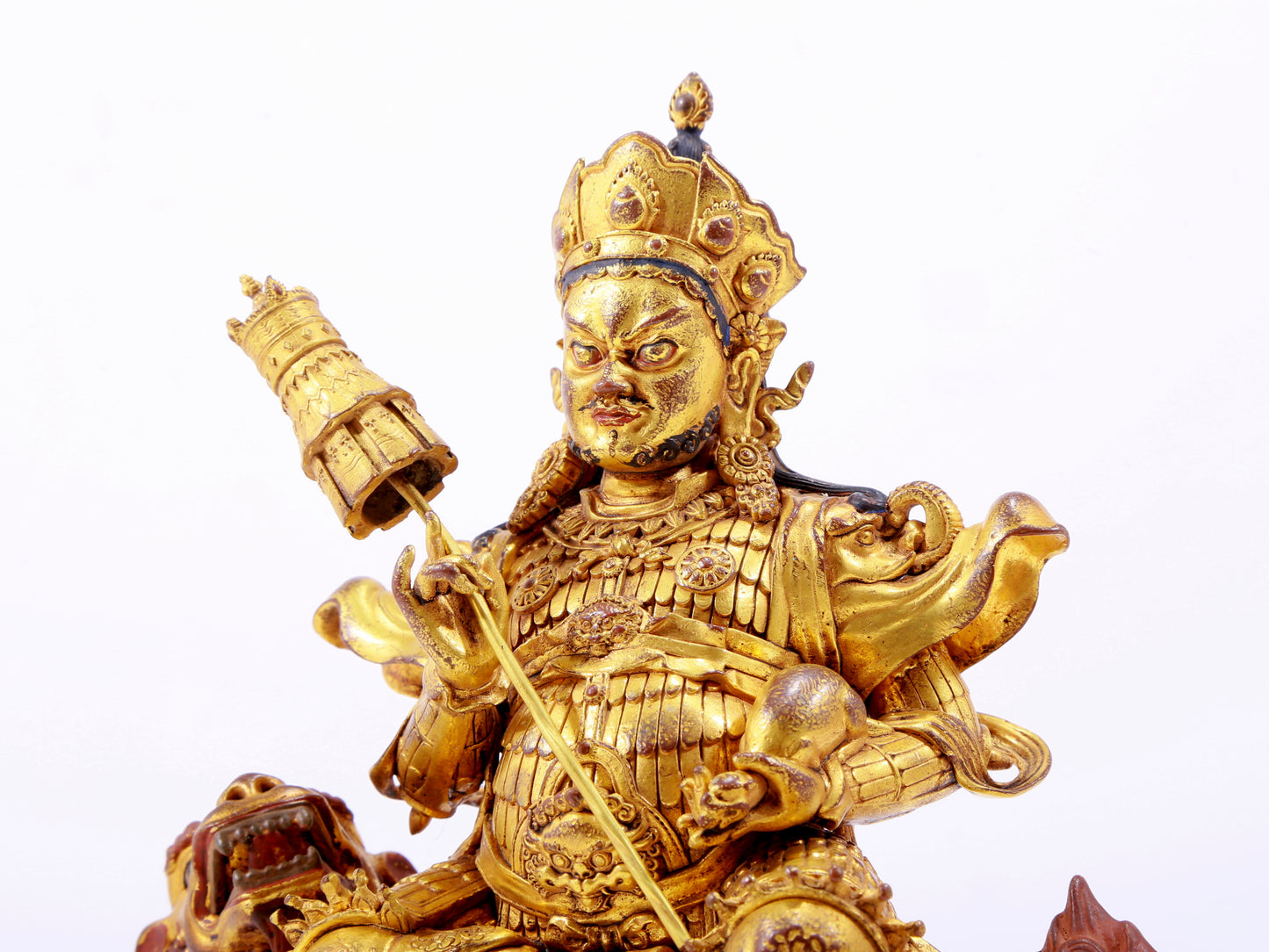 A majestic gilt bronze statue of the King of Treasures