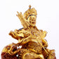 A majestic gilt bronze statue of the King of Treasures