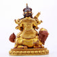 A majestic gilt bronze statue of the King of Treasures