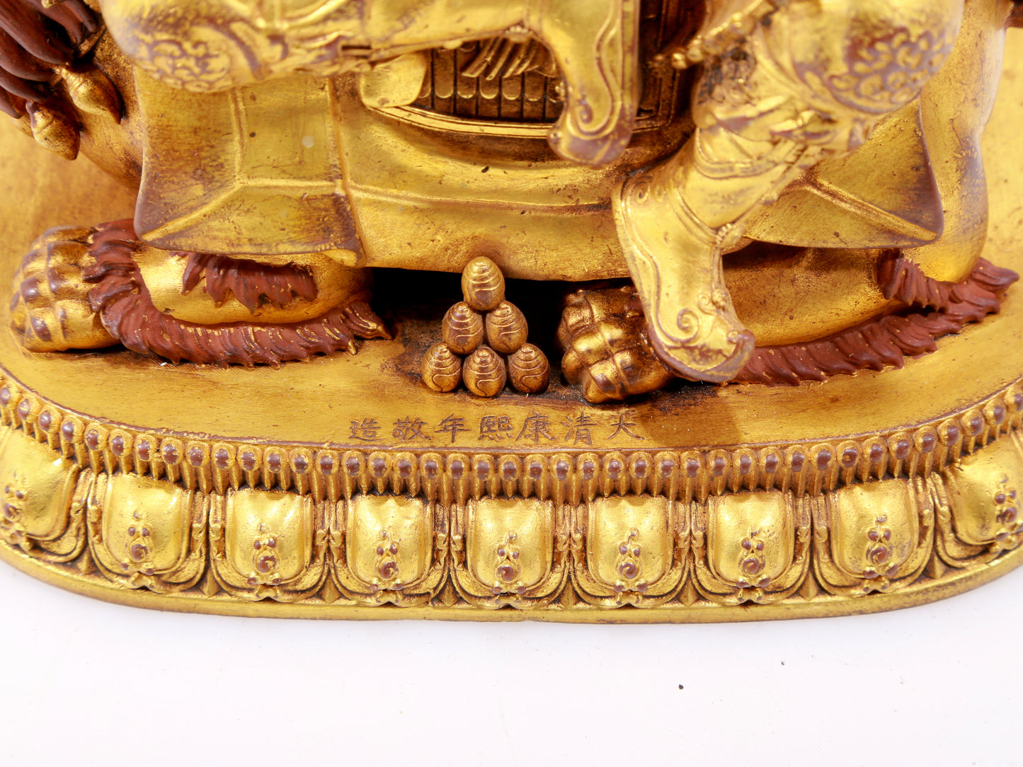 A majestic gilt bronze statue of the King of Treasures