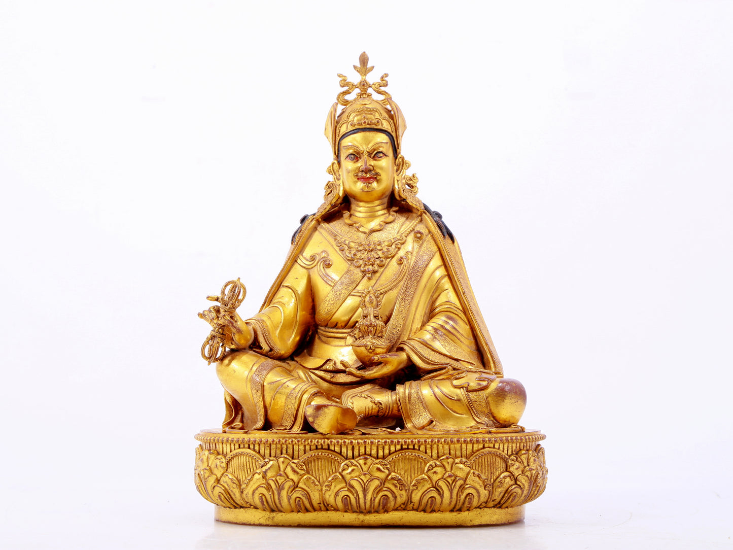 A solemn gilt bronze statue of Padmasambhava