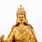 A solemn gilt bronze statue of Padmasambhava