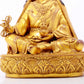 A solemn gilt bronze statue of Padmasambhava