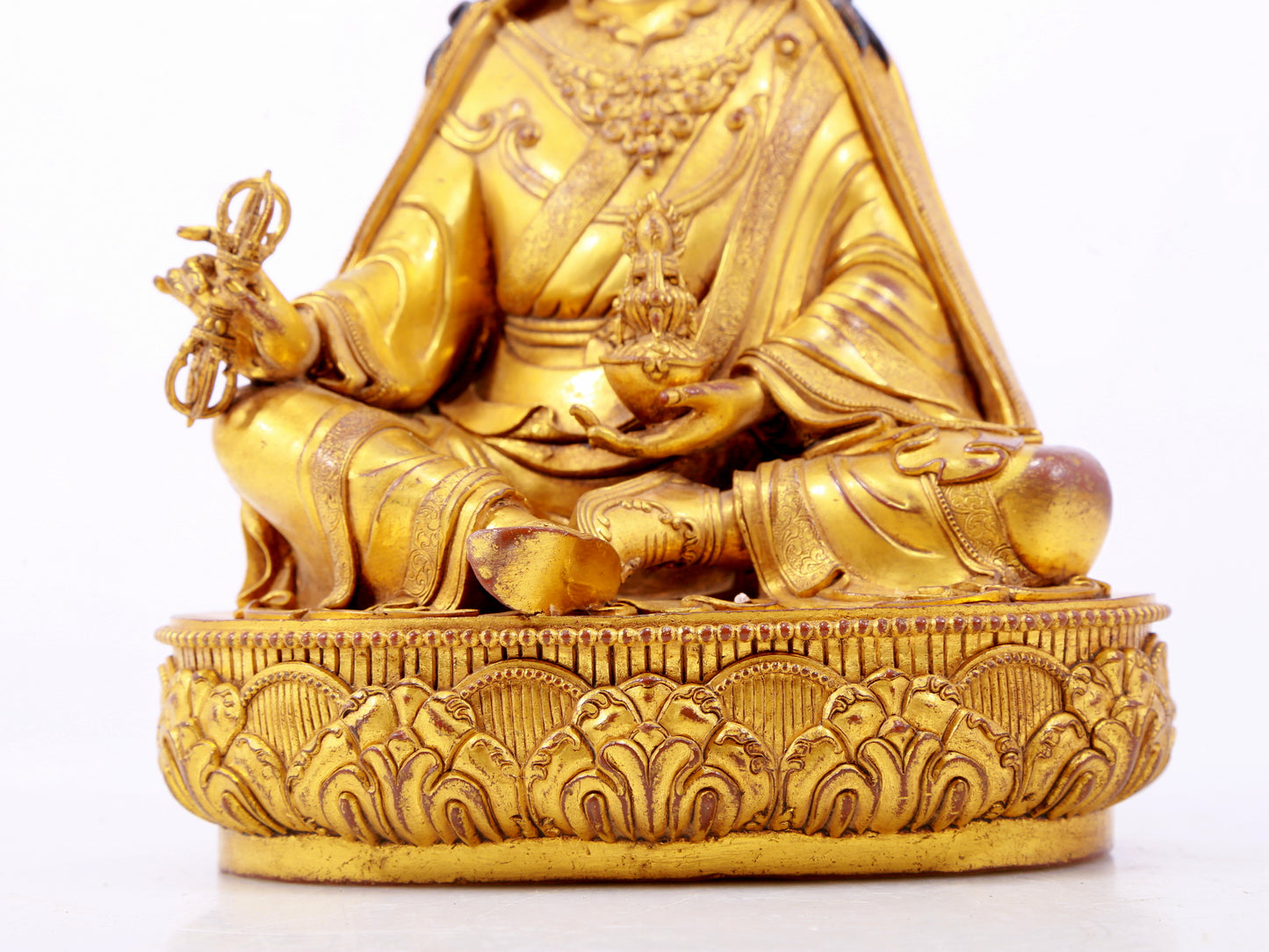 A solemn gilt bronze statue of Padmasambhava