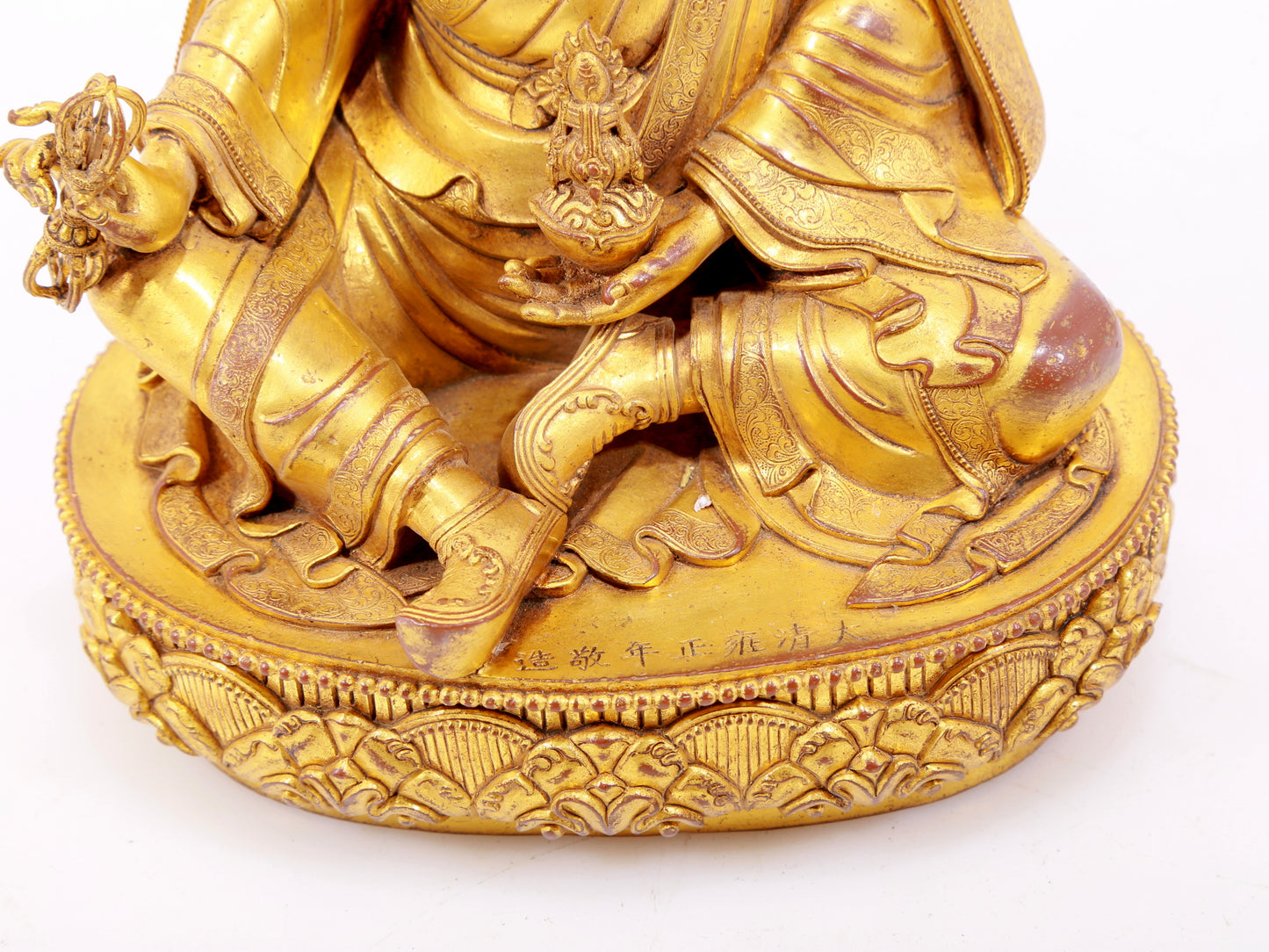 A solemn gilt bronze statue of Padmasambhava