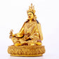 A solemn gilt bronze statue of Padmasambhava