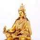 A solemn gilt bronze statue of Padmasambhava