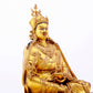 A solemn gilt bronze statue of Padmasambhava