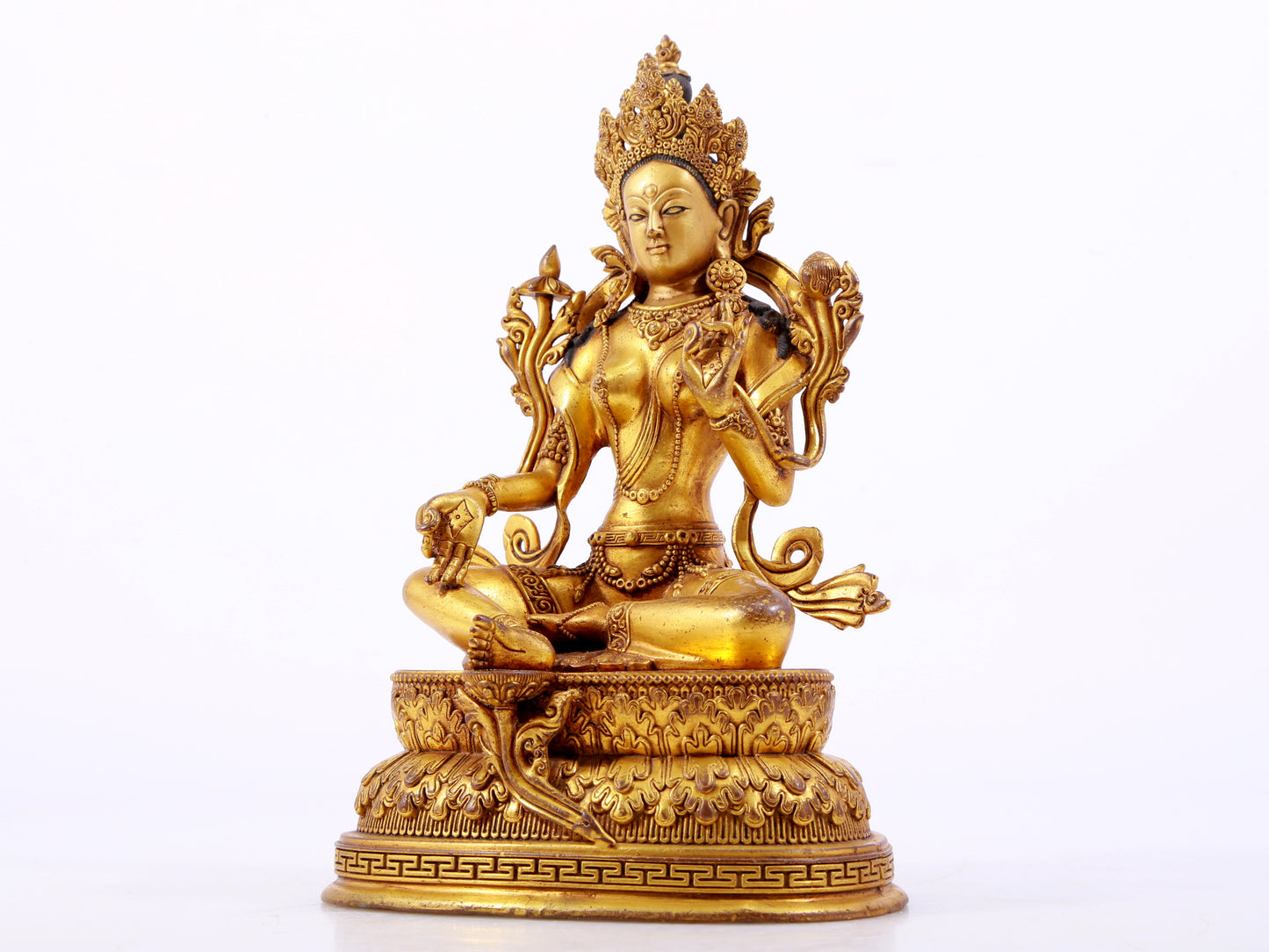 A majestic gilt bronze statue of green Tara