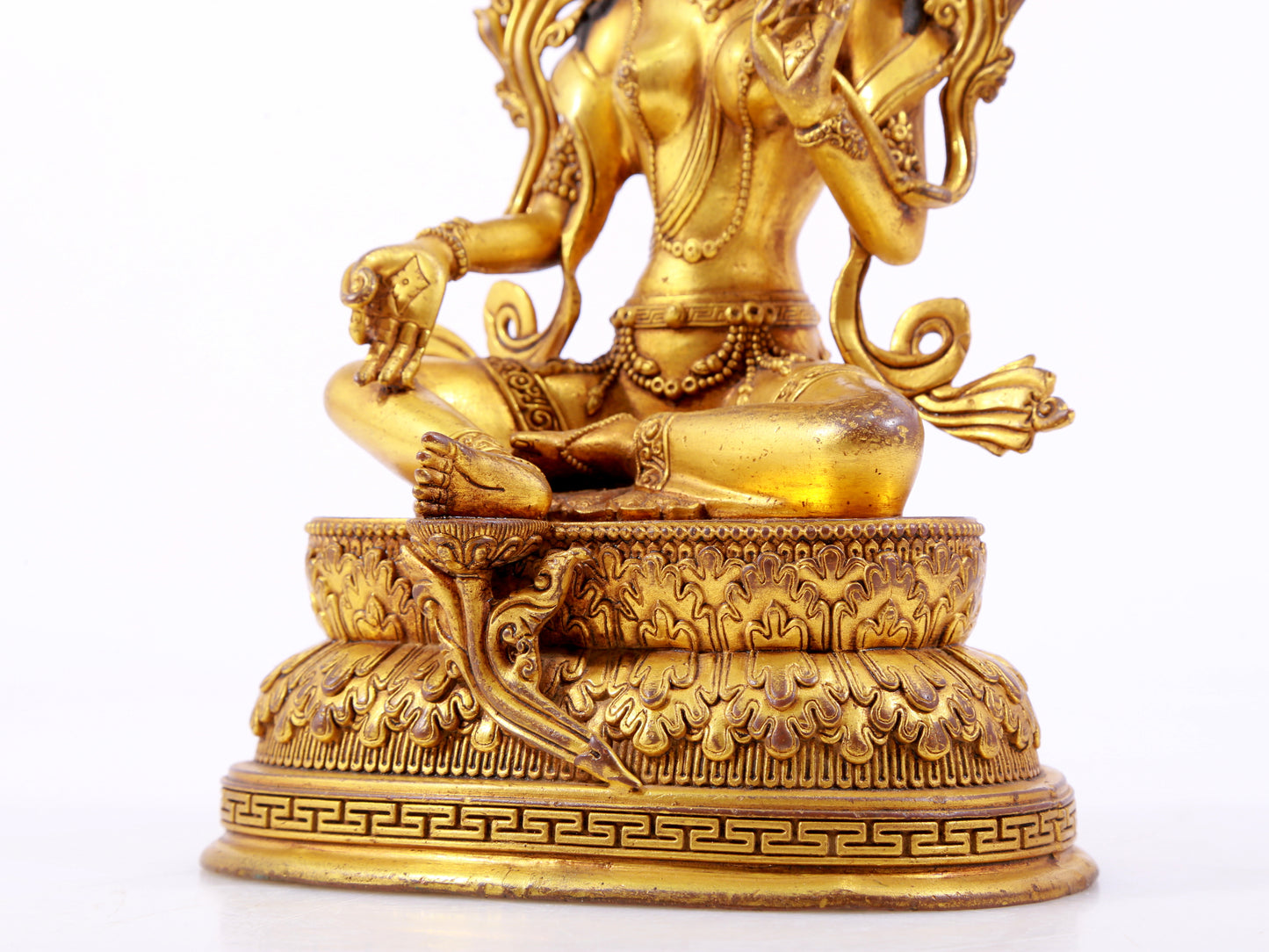 A majestic gilt bronze statue of green Tara