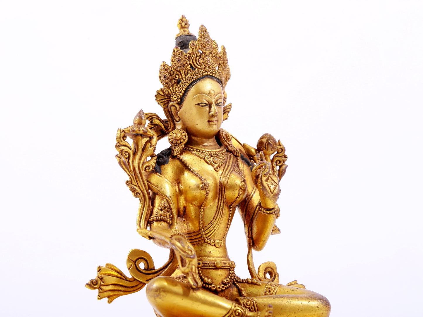 A majestic gilt bronze statue of green Tara