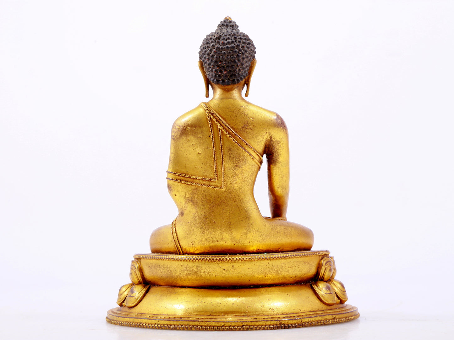 A majestic gilt bronze statue of Sakyamuni