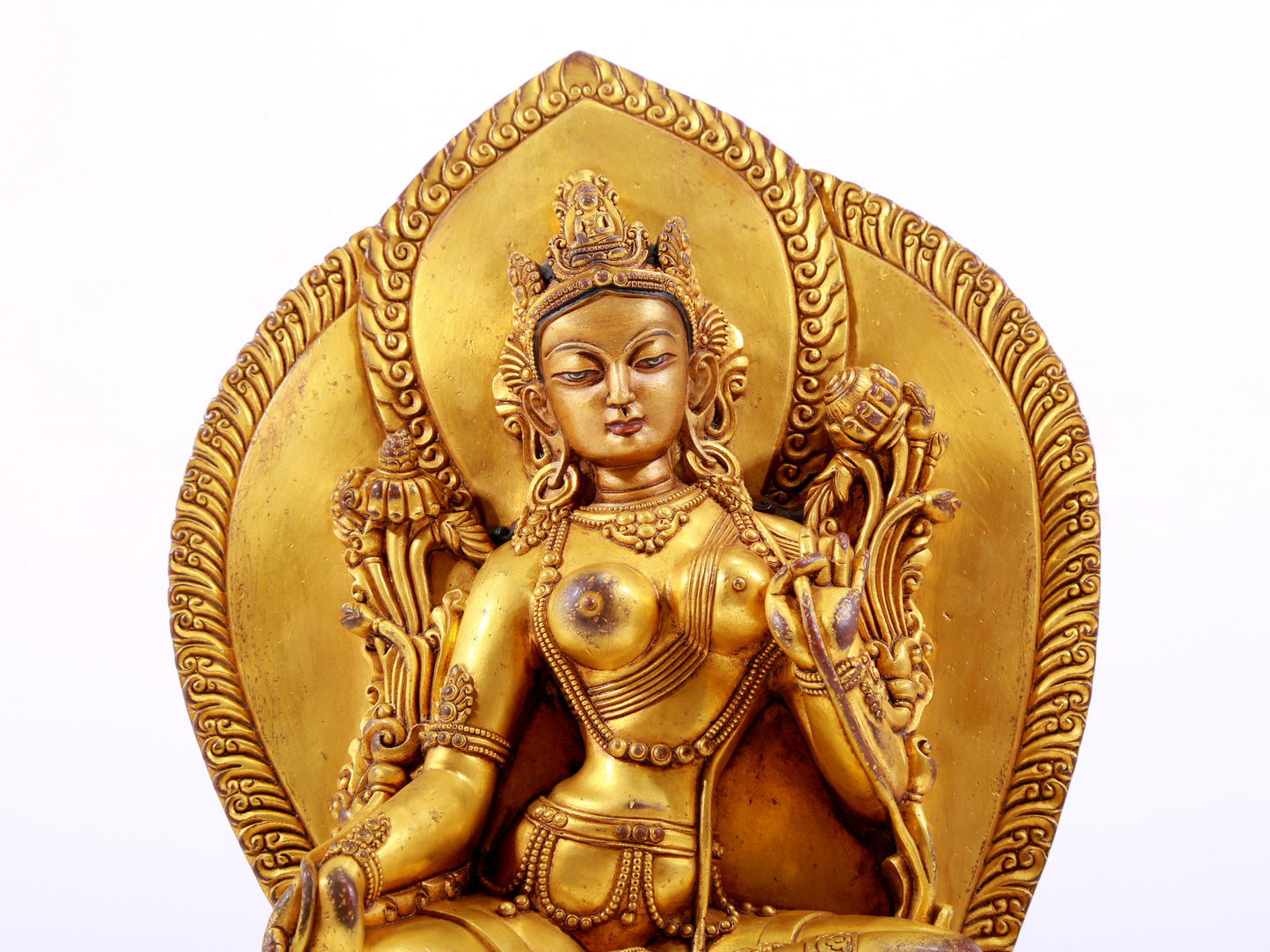 A majestic gilt bronze statue of green Tara