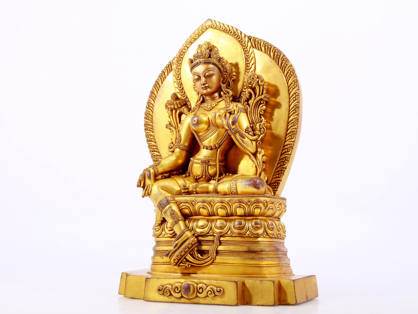 A majestic gilt bronze statue of green Tara