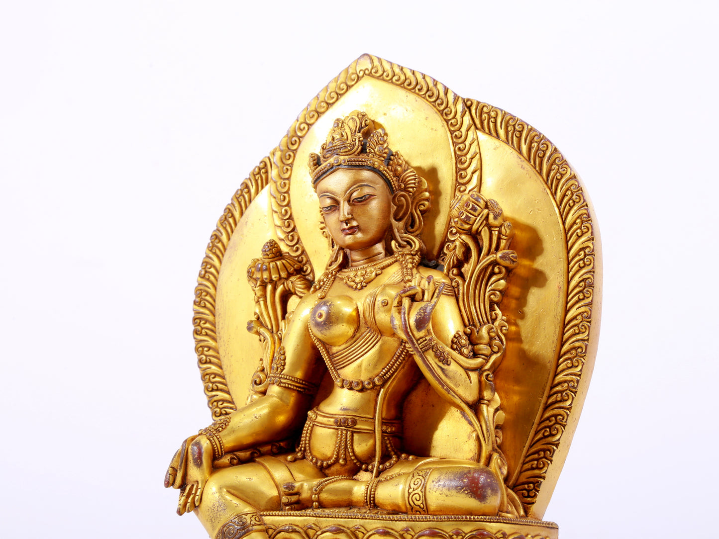 A majestic gilt bronze statue of green Tara