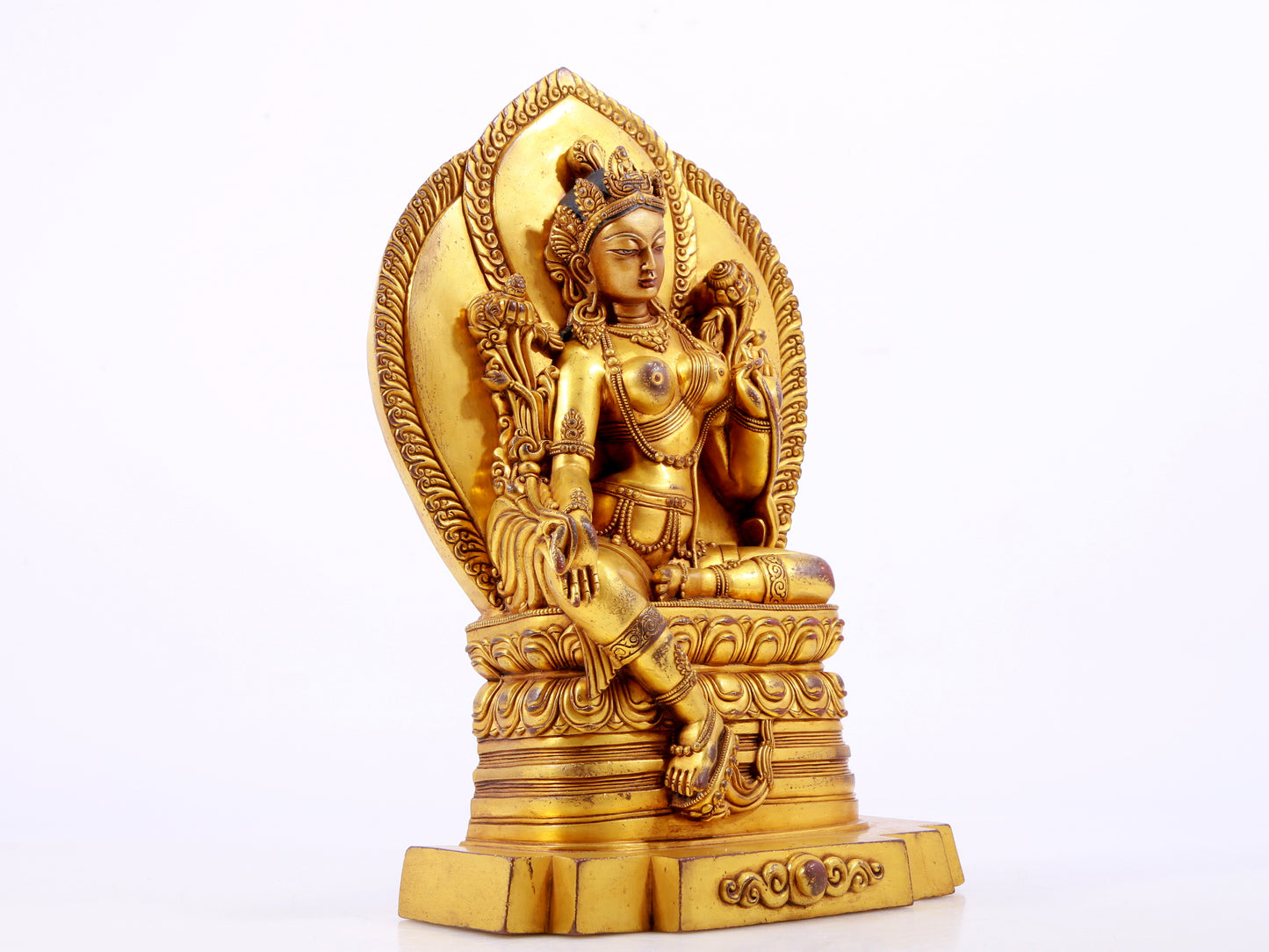 A majestic gilt bronze statue of green Tara