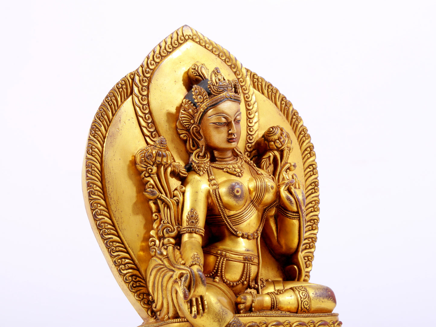 A majestic gilt bronze statue of green Tara