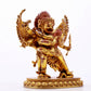 A solemn gilt bronze Vajra statue