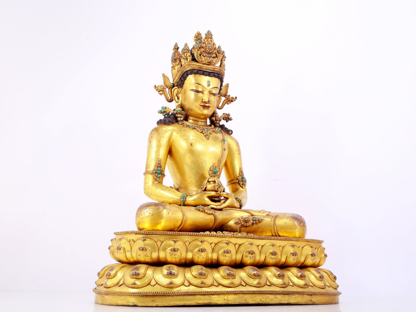 A solemn gilt bronze statue of Amitayus Buddha inlaid with hundreds of treasures