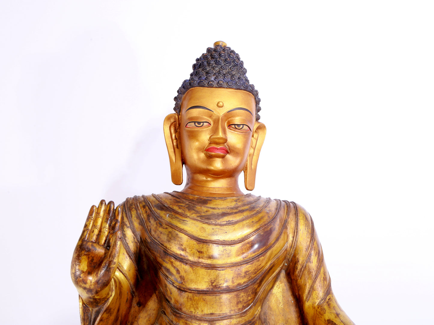 A majestic gilt bronze statue of Sakyamuni