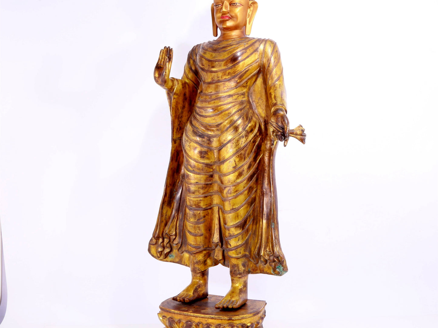 A majestic gilt bronze statue of Sakyamuni