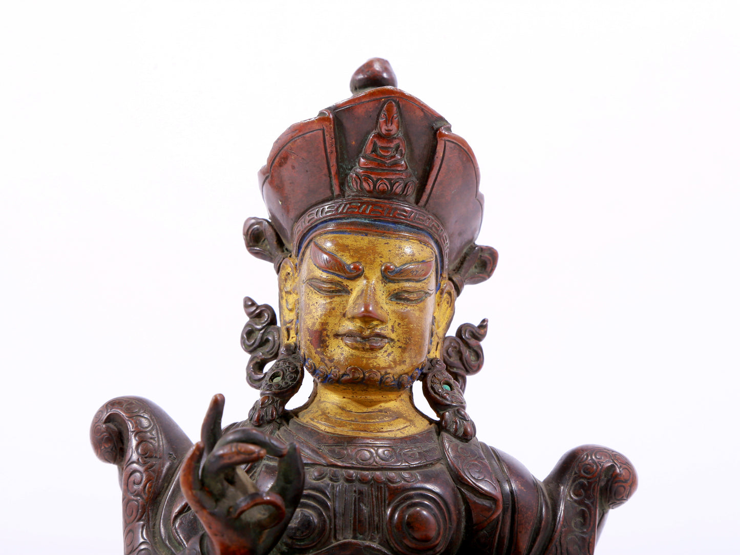 A solemn gilt bronze statue of the God of Wealth