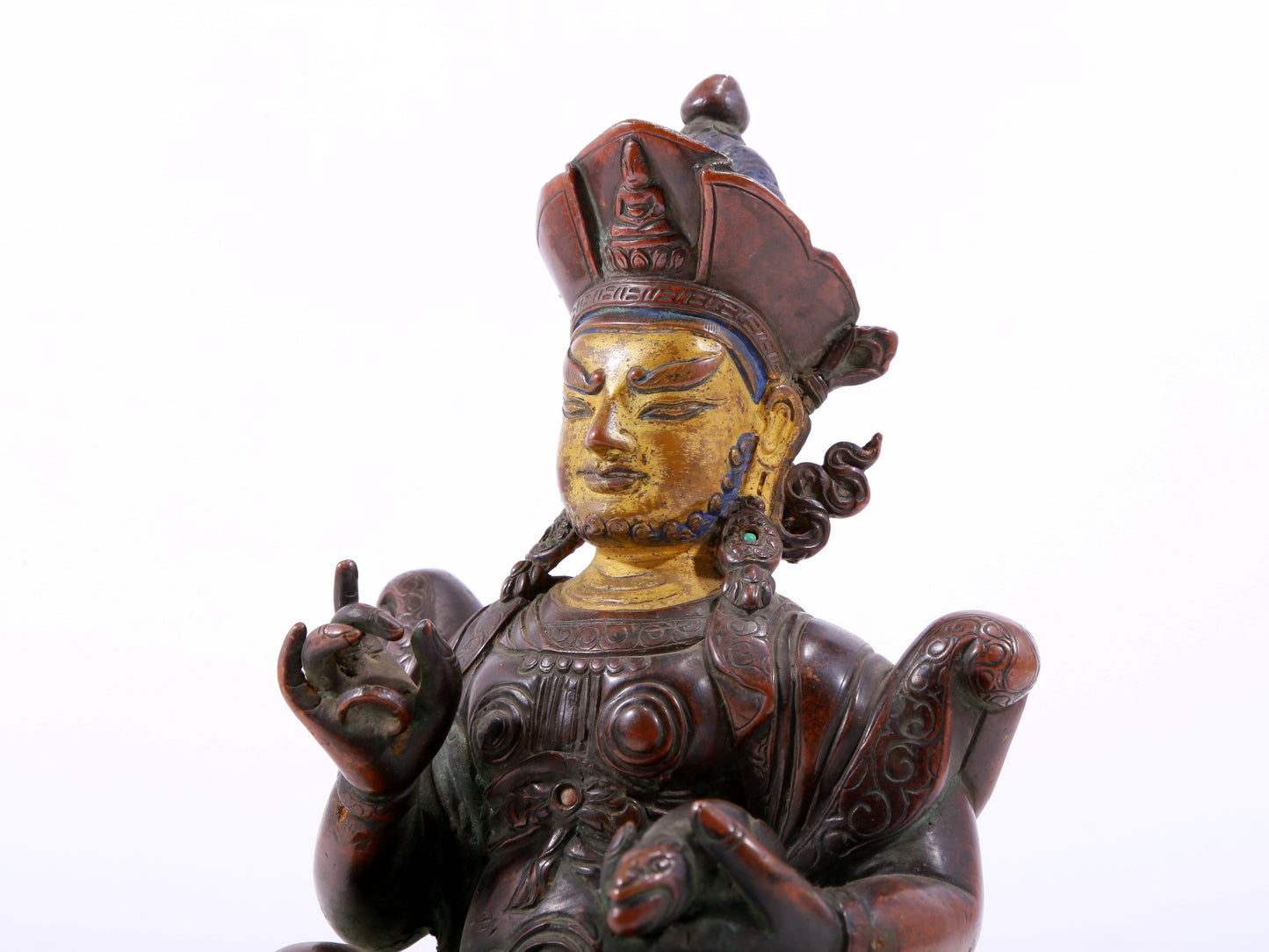 A solemn gilt bronze statue of the God of Wealth