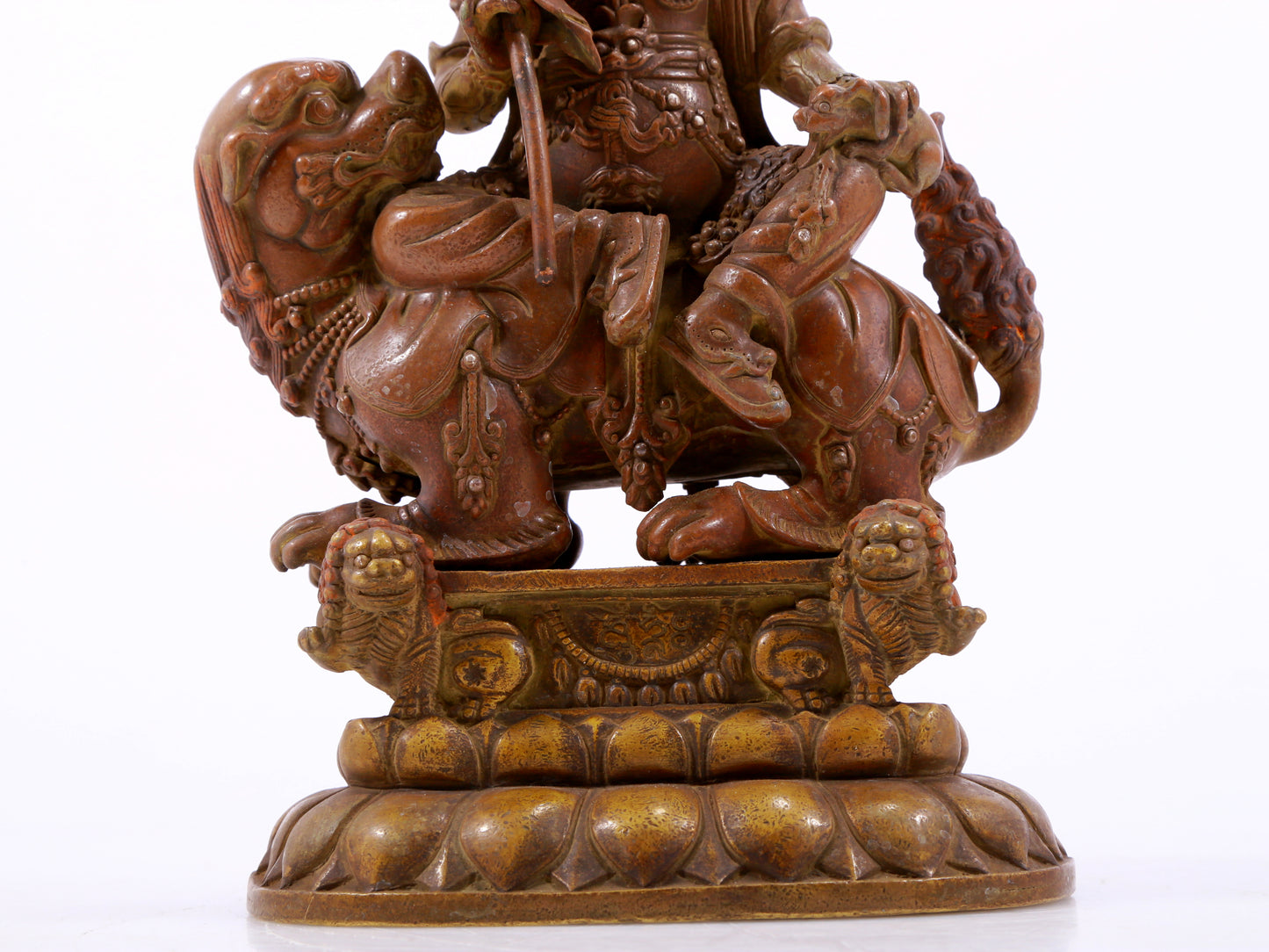 A solemn alloy copper inlaid silver statue of the God of Wealth riding a lion