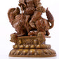 A solemn alloy copper inlaid silver statue of the God of Wealth riding a lion