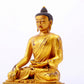 A majestic gilt bronze statue of Sakyamuni