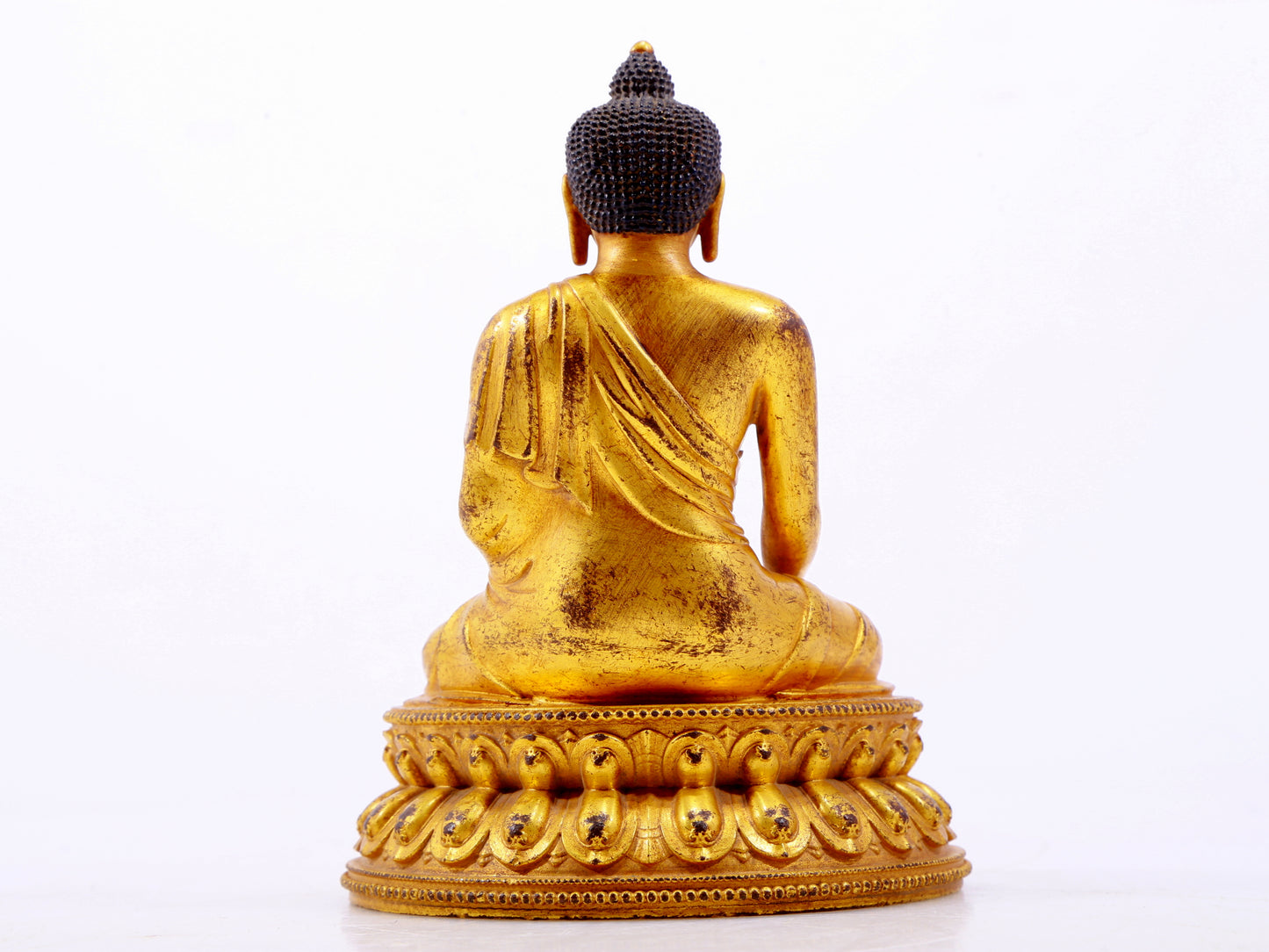 A majestic gilt bronze statue of Sakyamuni