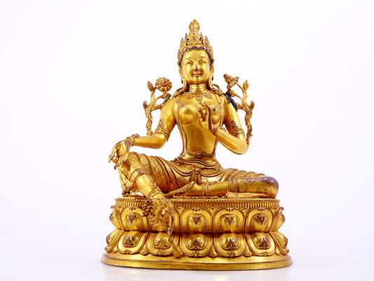 A majestic gilt bronze statue of green Tara