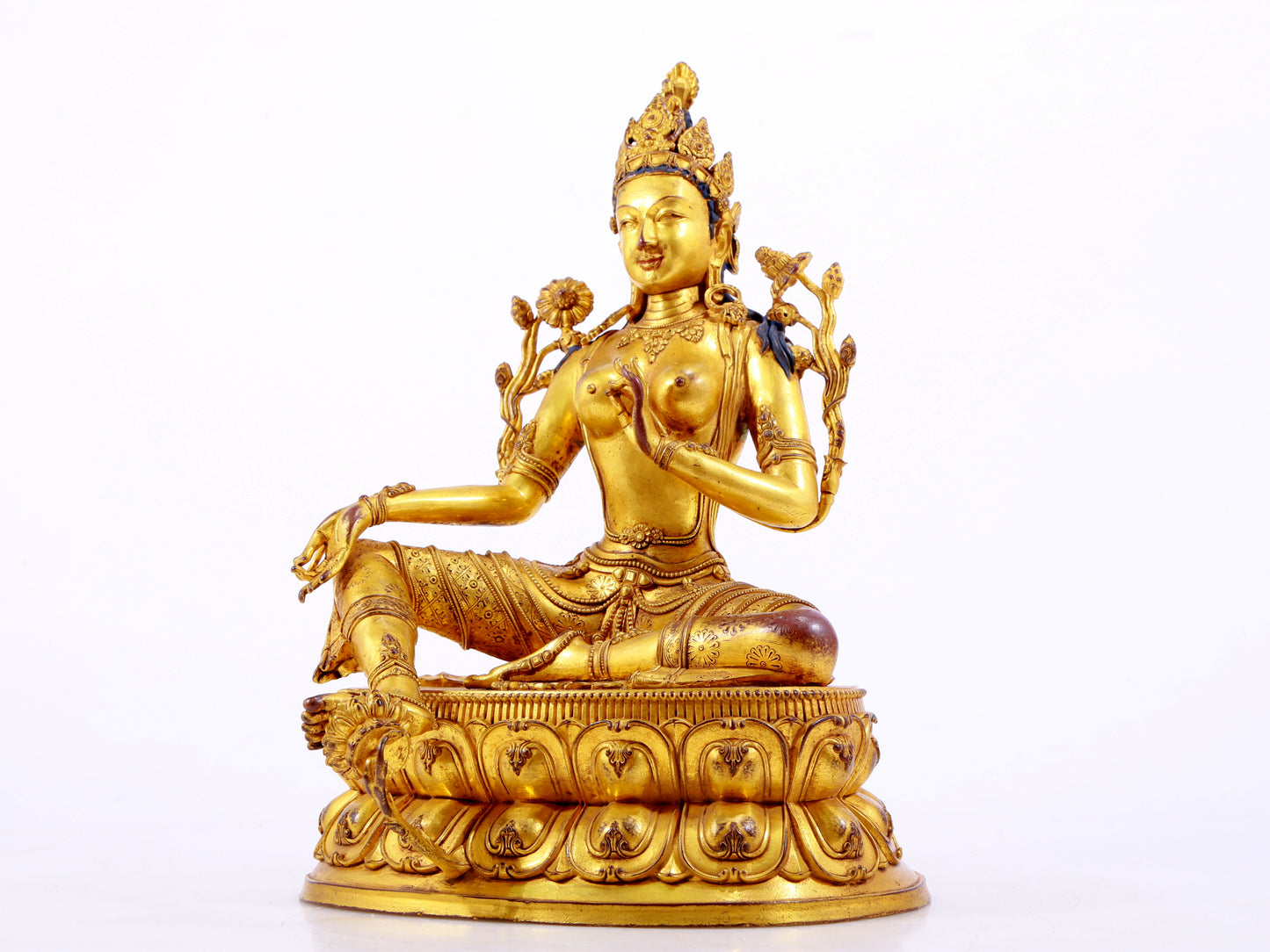 A majestic gilt bronze statue of green Tara