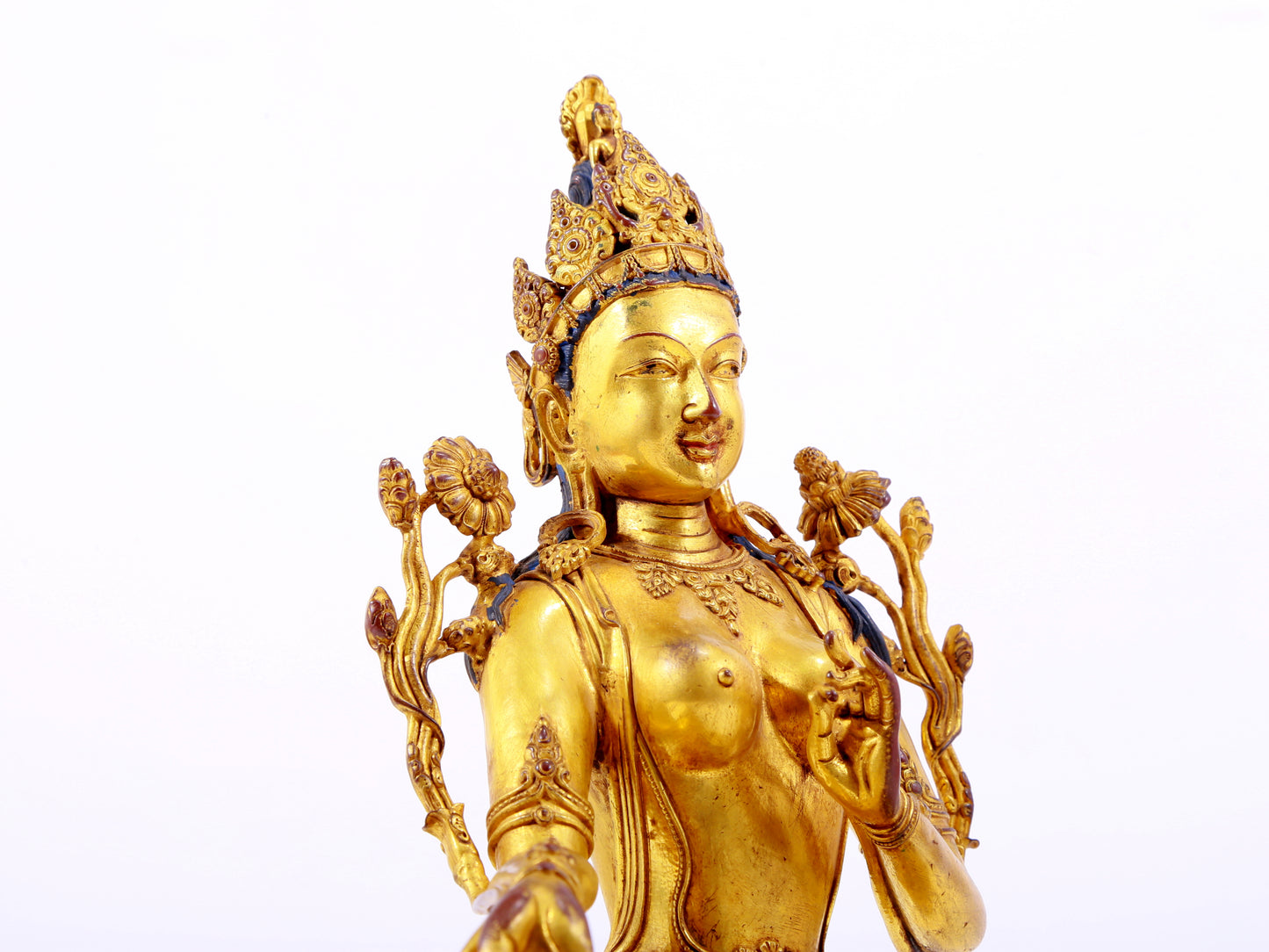 A majestic gilt bronze statue of green Tara