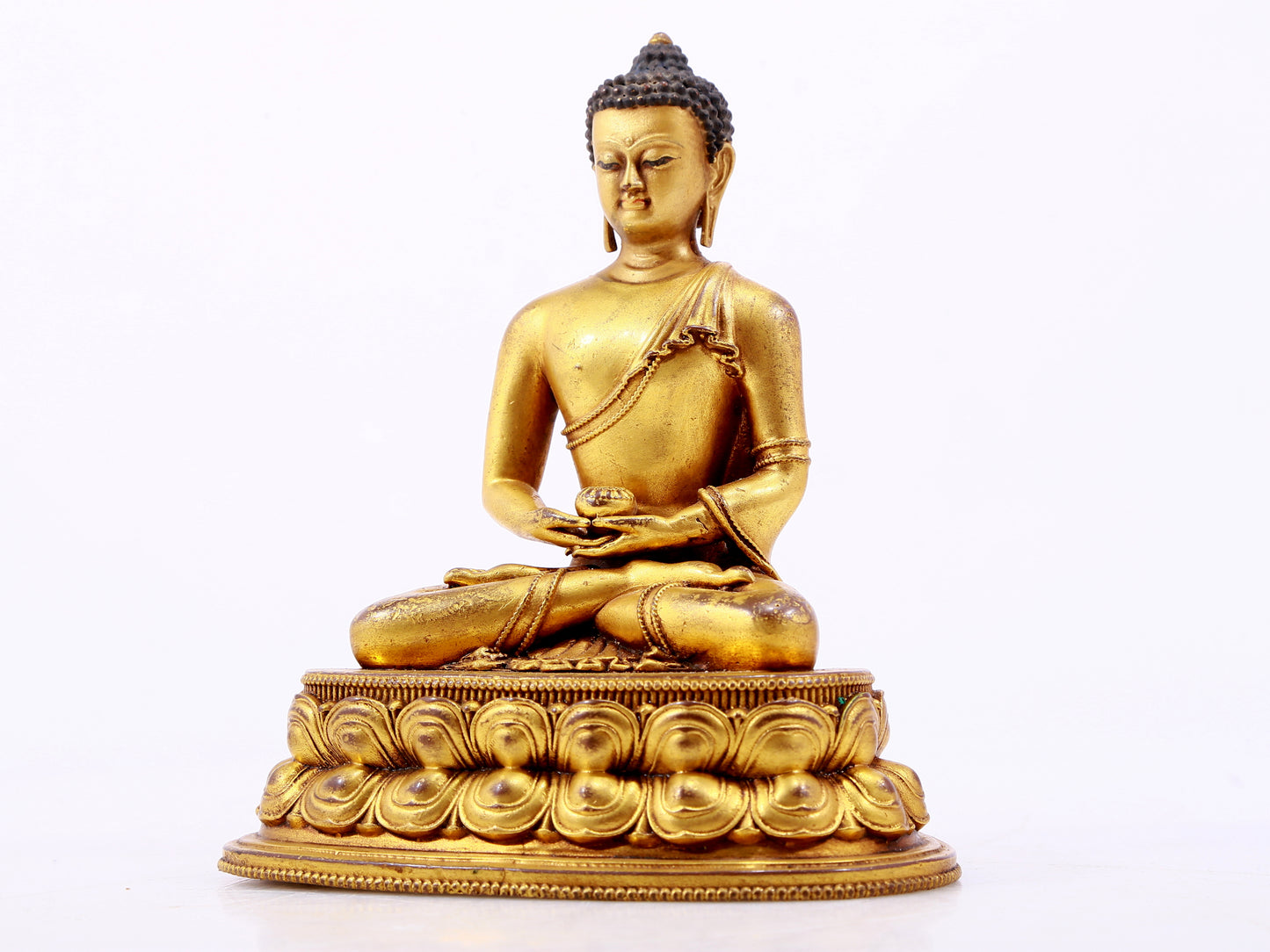 A majestic gilt bronze statue of Sakyamuni